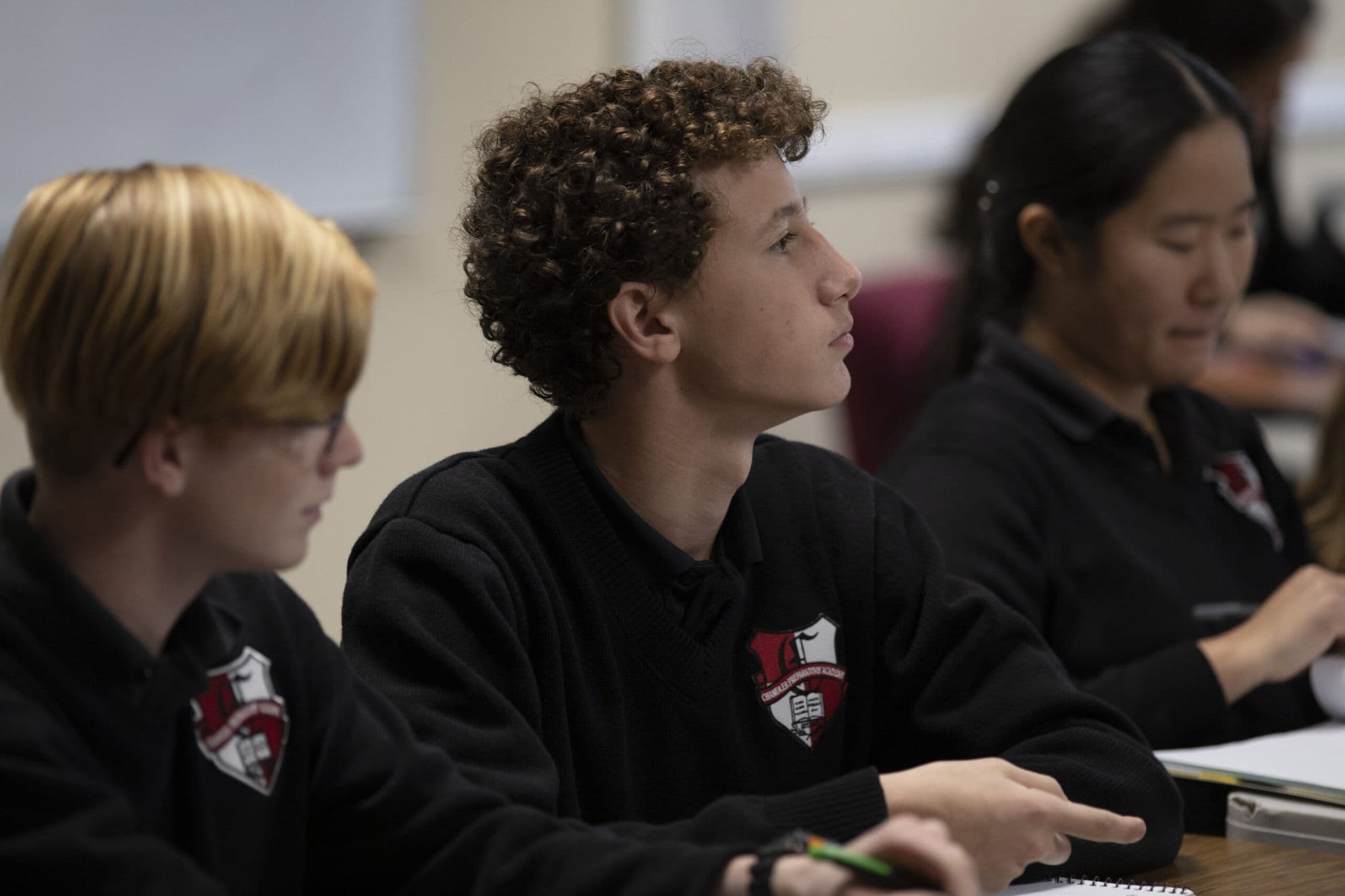 Chandler Prep students in seminar, attentive in their academy crests