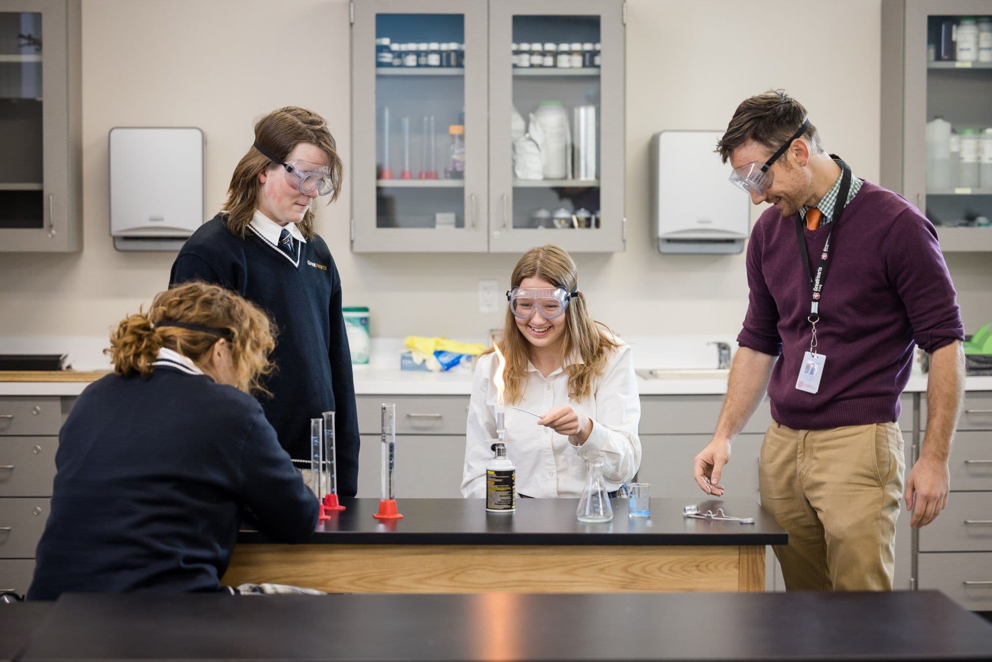 Great Hearts Irving upper-school students in a chemistry lab with their teacher