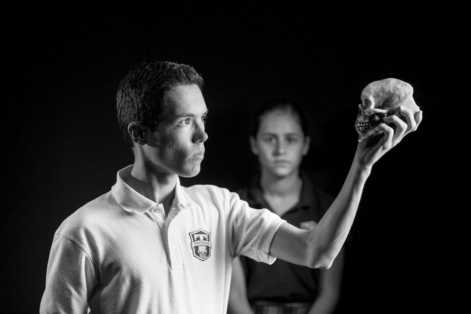Trivium Prep students in a black-and-white editorial portrait — Hamlet's skull