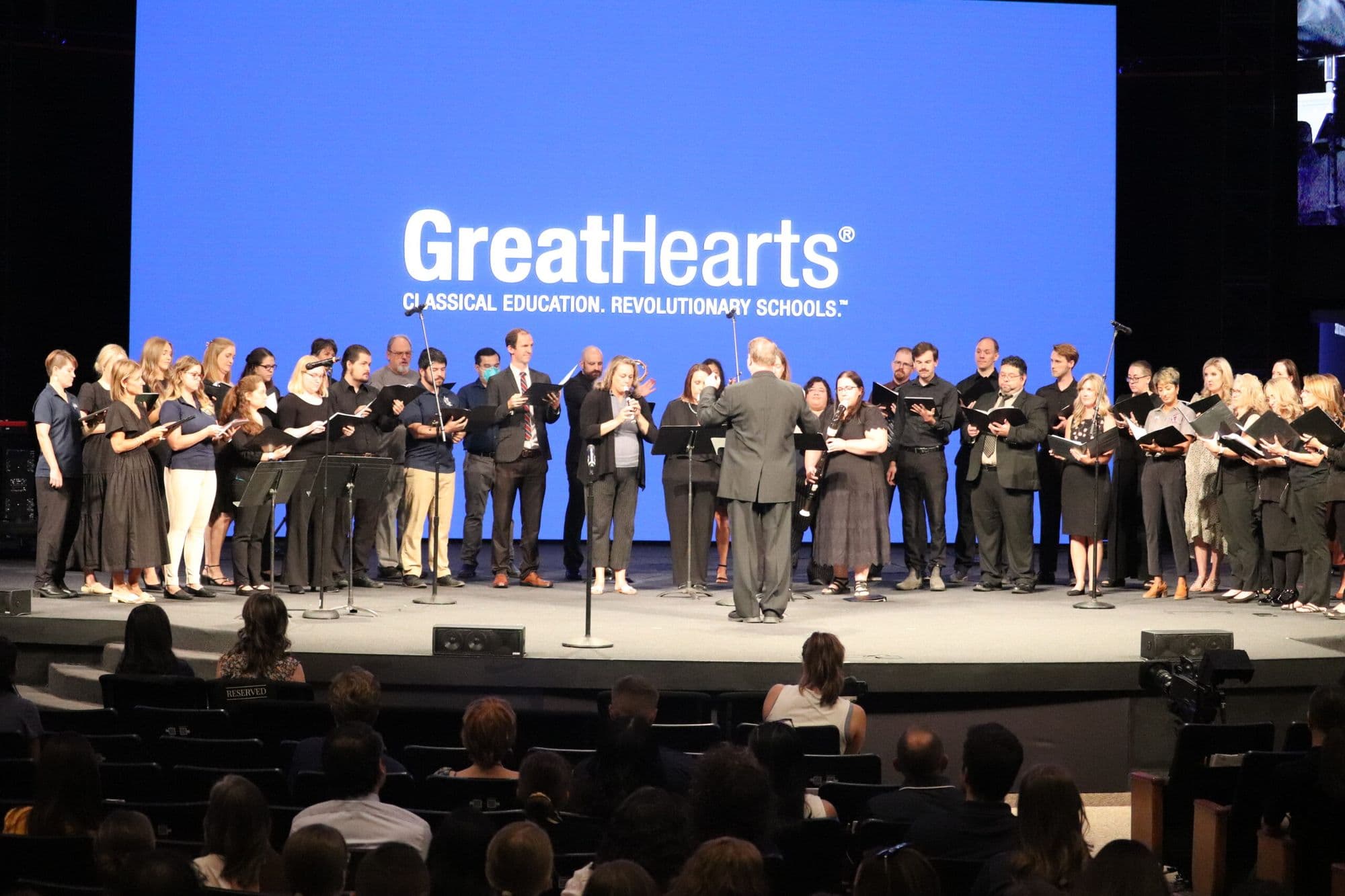 Great Hearts network faculty choir performing at the annual academy gathering